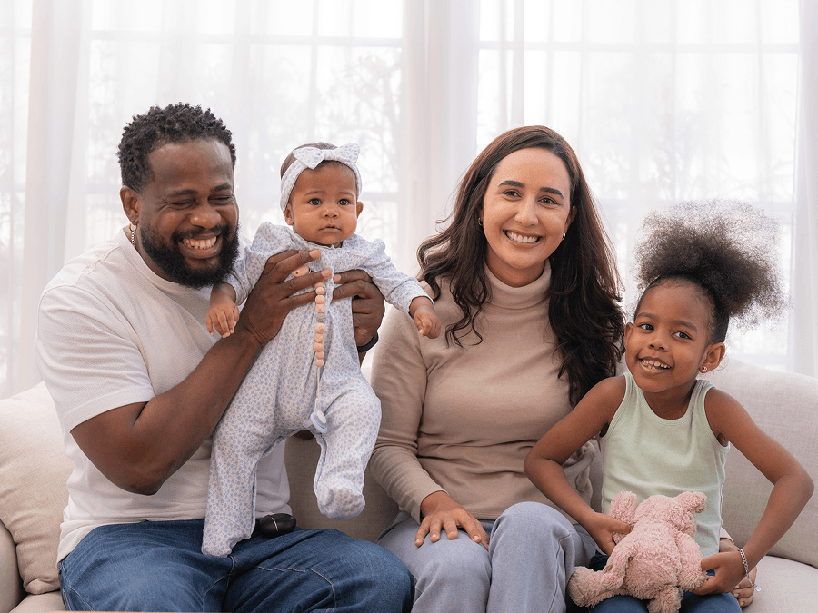 Multiracial family with young daughter and baby