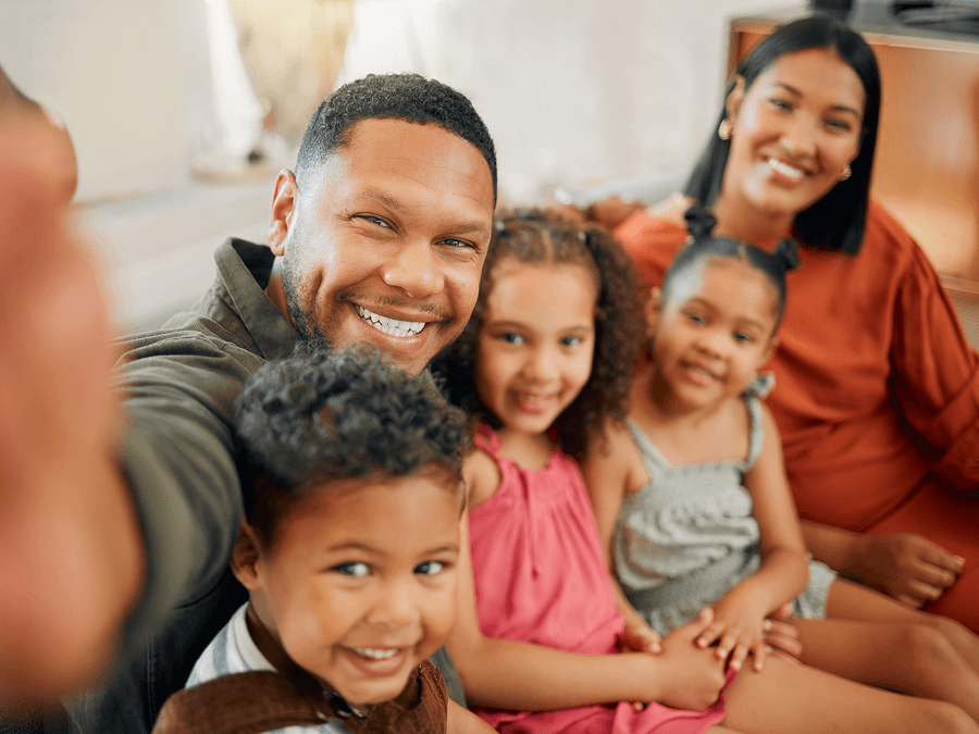 Family selfie with mom, dad, and three kids